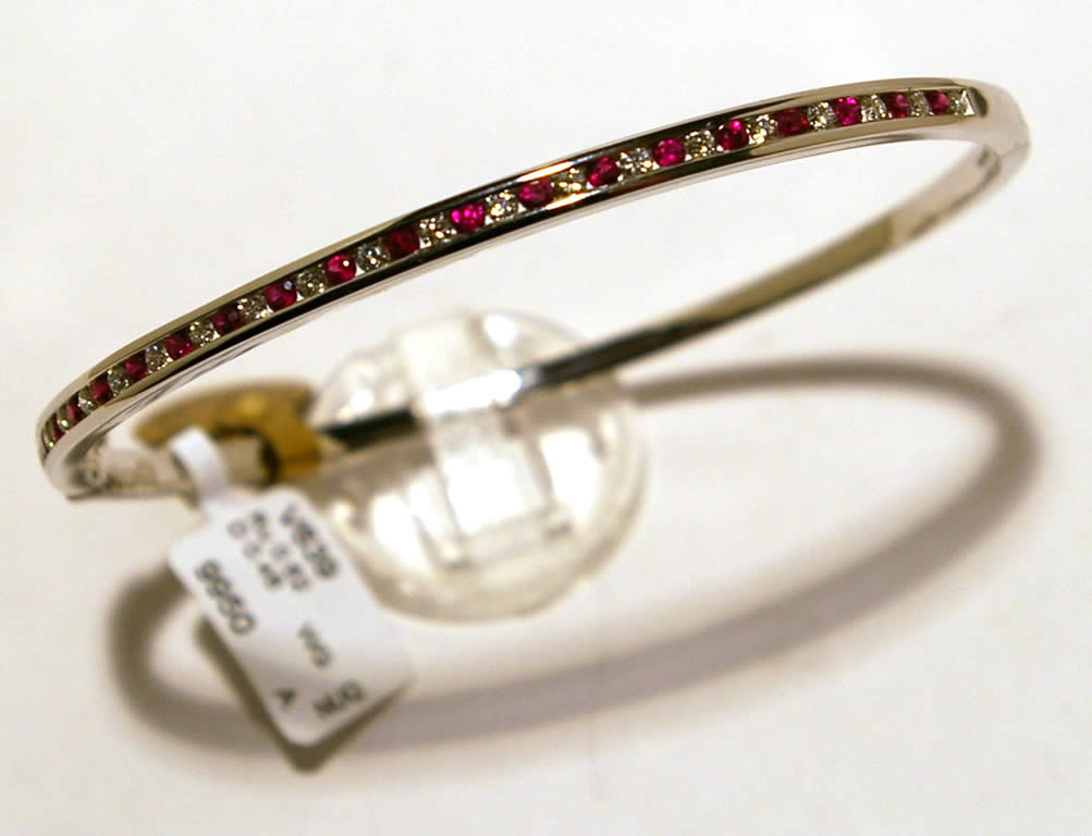 18ct White Gold Ruby and Diamond Channel Set Hinged Bangle