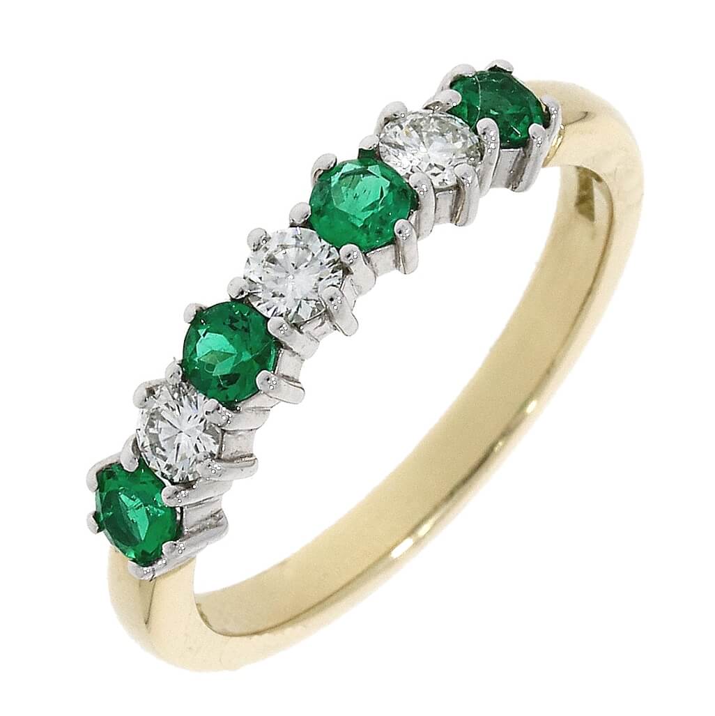 Emerald 7 Stone Claw Eternity
